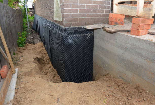 SJ Waterproofing Pros technician performing targeted Interior Drainage System assessment in Flora, IN